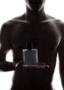 Man with perfume bottle Royalty Free Stock Photo