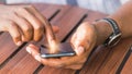 Man person holding a modern smart phone and touching a finger to blank screen Royalty Free Stock Photo