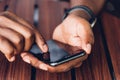 Man person holding a modern smart phone and touching a finger to blank screen Royalty Free Stock Photo