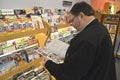 Man looking at  magazine at a newstand in Annapolis, Maryland Royalty Free Stock Photo