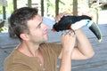 Man petting a colourful toucan bird