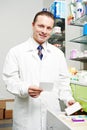 Man pharmacy chemist in drugstore Royalty Free Stock Photo