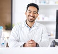 Man, pharmacy and portrait with happy and smile of pharmacist ready for healthcare support and work. Clinic, doctor and Royalty Free Stock Photo