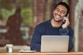 Man, phone call and laptop in cafe for remote work with smile, contact or agreement at media agency. Writer, computer Royalty Free Stock Photo