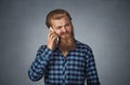 Man on the phone with headache Cellular mobile radiation concept Royalty Free Stock Photo