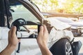 A man photographed his vehicle with accidental damage with a smart phone.Car Insurance Concept Royalty Free Stock Photo