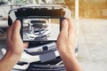 A man photographed his vehicle with accidental damage with a smart phone.Car Insurance Concept Royalty Free Stock Photo