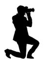 Man photographer silhouette lunges taking picture on white