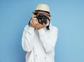 Man photographer with a SLR camera in his hands takes photos Royalty Free Stock Photo