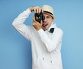 Man photographer with a SLR camera in his hands takes photos Royalty Free Stock Photo