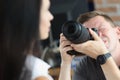 Man photographer is taking pictures of woman closeup Royalty Free Stock Photo