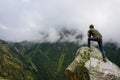 Man photographing beautiful scenery on Transfagarasan, Romania