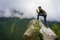 Man photographing beautiful scenery on Transfagarasan, Romania