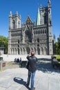 Man photographing Nidaros Cathedral Trondheim