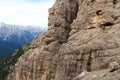 Man photographing people on the Via Ferrata Severino Casara with bridge in Sexten Dolomites mountains, South Tyrol