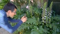 Man photographing plants