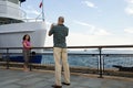 Man photographing woman