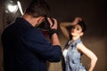 Man photographing woman in studio Royalty Free Stock Photo