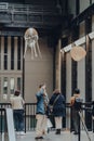 Man photographs aerobes of Anicka Yi`s installation In Love With The World in Turbine Hall of Tate Modern museum in London, UK Royalty Free Stock Photo