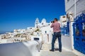 Man photographs  island of Santorini Royalty Free Stock Photo