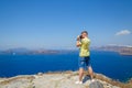 Man photographs the landscape of Santorini Royalty Free Stock Photo