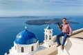 Man photographs island of Santorin Royalty Free Stock Photo