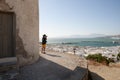 A man photographs the view in Mykonos