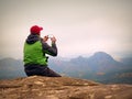 Man photography by phone. Trip in mountains, sharp rock empire Royalty Free Stock Photo