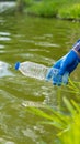 Man picking up plastic bottles, picking up trash in the world, cleaning the forest in the park. to preserve the charity environmen