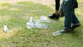 Man picking up plastic bottles, picking up trash in the world, cleaning the forest in the park. to preserve the charity environmen