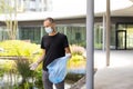 man picking up plastic household waste in park Royalty Free Stock Photo