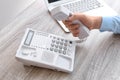 Man picking up telephone at table Royalty Free Stock Photo