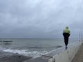 Man on a pier on a rainy day Royalty Free Stock Photo