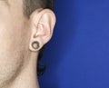 Man with pierced ear. Royalty Free Stock Photo