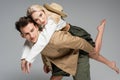 man piggybacking cheerful blonde woman isolated Royalty Free Stock Photo