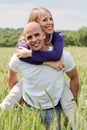 Man piggybacking her girlfriend Royalty Free Stock Photo