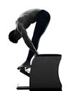 Man pilates chair exercises fitness isolated Royalty Free Stock Photo
