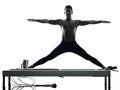 Man pilates reformer exercises fitness isolated Royalty Free Stock Photo