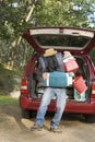 Man with pile of luggage Royalty Free Stock Photo