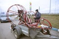 Man pilot preparing for flight the powered parachute set on the trailer. Royalty Free Stock Photo