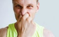 Man Pinches Nose Looks With Disgust Something Stinks Bad Smell Royalty Free Stock Photo