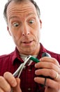 Man pinching a PS2 plug with pliers Royalty Free Stock Photo