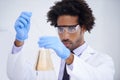 Man, pipette and flask for science in laboratory, experiment and liquid for biochemistry in container. Black male person Royalty Free Stock Photo