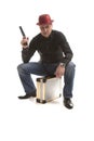 Man with a pistol sitting on the case Royalty Free Stock Photo