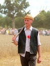 Man with a pitchfork at the Fete de la Moisson at Saint Denis de Gastines 2018