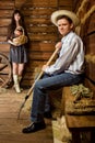 Man with pitchfork in straw hat woman with basket Royalty Free Stock Photo