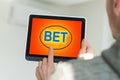 man placing bet with tablet computer, closeup Royalty Free Stock Photo