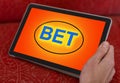 man placing bet with tablet computer, closeup Royalty Free Stock Photo