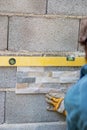 Man placing ornamental tile