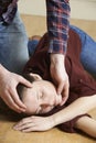 Man Placing Woman In Recovery Position After Accident Royalty Free Stock Photo